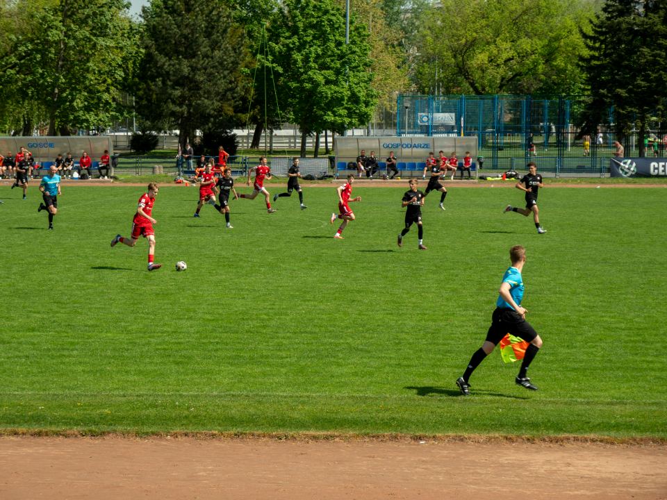 Academy players in matching kit training on a pitch